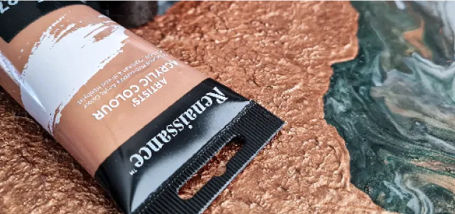 Textured surface painted with acrylic colours.